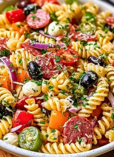 Bowl of easy Italian pasta salad with vegetables and dressing