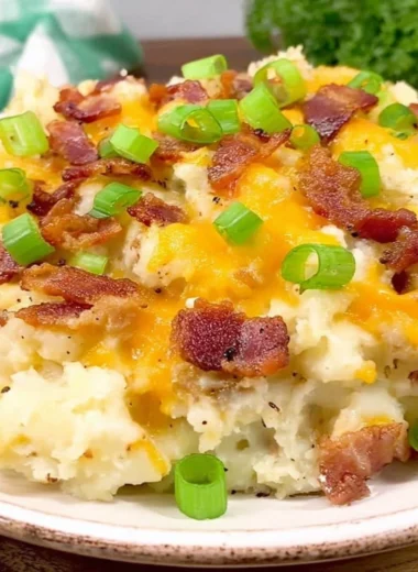 Delicious twice baked potato casserole topped with cheese and herbs