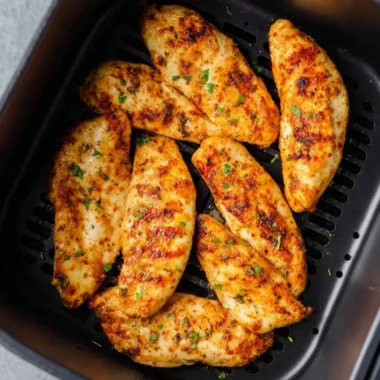 Air fryer chicken tenders without breading served on a plate