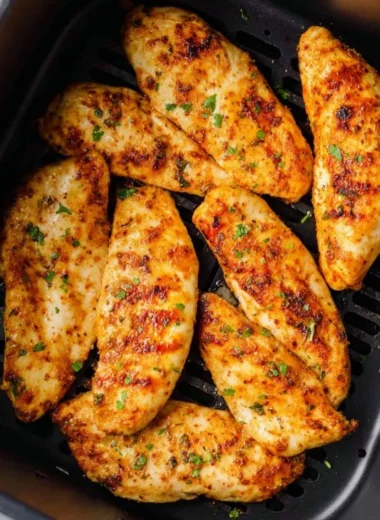 Air fryer chicken tenders without breading served on a plate