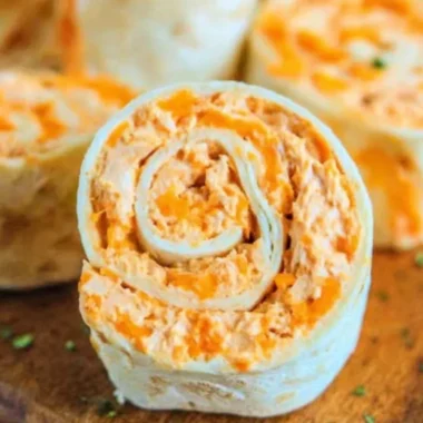 Buffalo Chicken Roll Ups served on a plate with ranch dipping sauce
