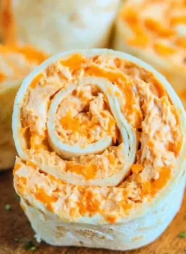 Buffalo Chicken Roll Ups served on a plate with ranch dipping sauce