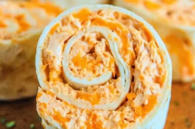 Buffalo Chicken Roll Ups served on a plate with ranch dipping sauce