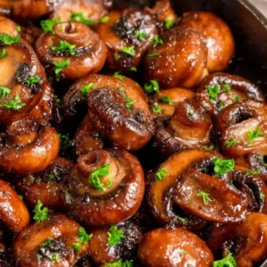 Buttery sautéed mushrooms in a skillet