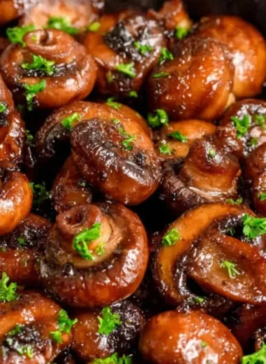 Buttery sautéed mushrooms in a skillet