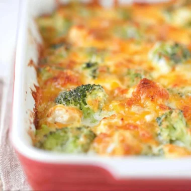 Delicious chicken broccoli bake topped with melted cheese and fresh herbs
