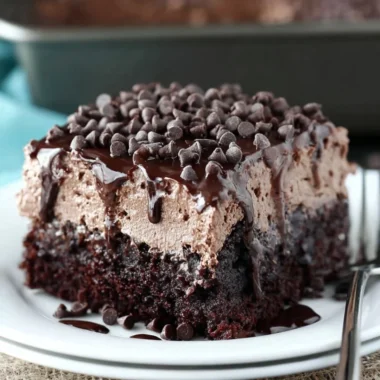 Deliciously moist Chocolate Poke Cake soaked in chocolate sauce