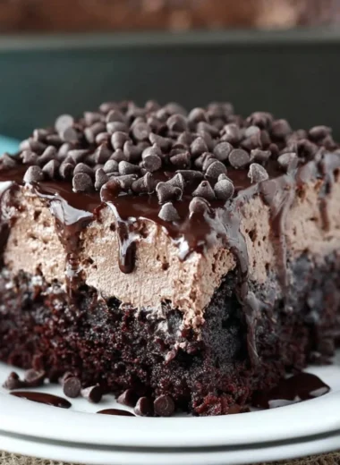 Deliciously moist Chocolate Poke Cake soaked in chocolate sauce