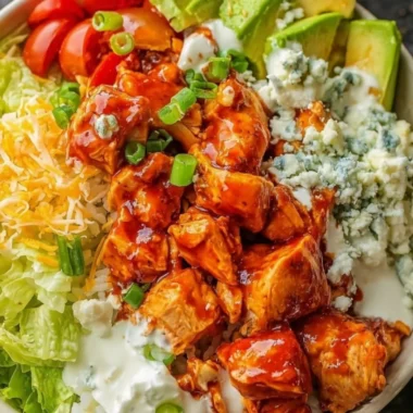 Delicious Buffalo chicken bowls with fresh toppings and vibrant colors.