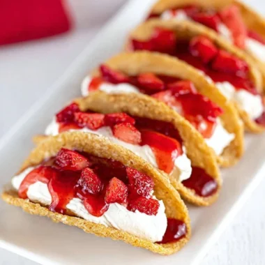 Delicious easy cheesecake tacos served on a plate with toppings
