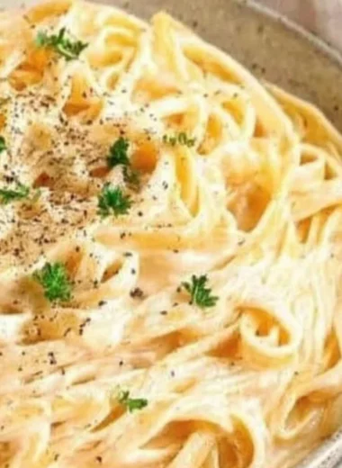 Delicious plate of creamy Fettuccine Alfredo topped with parsley