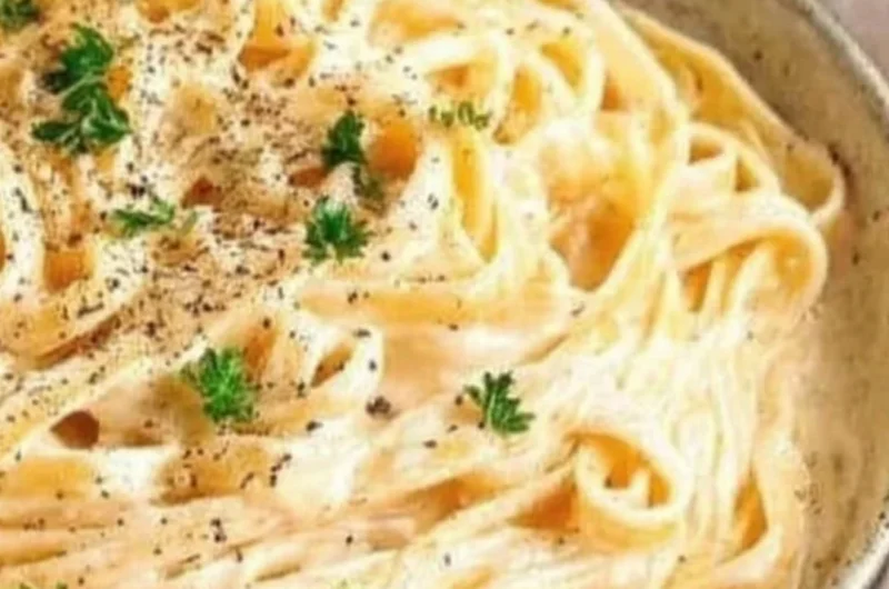 Delicious plate of creamy Fettuccine Alfredo topped with parsley