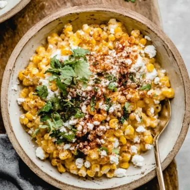Delicious Mexican street corn casserole topped with cheese and spices