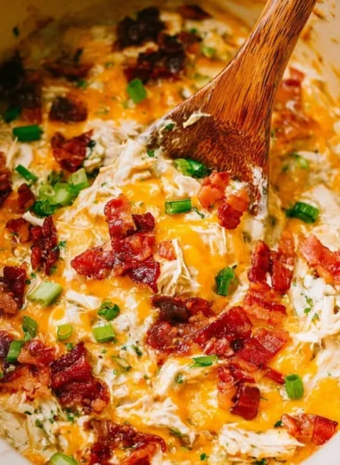 Delicious slow cooker crack chicken served with herbs and spices.