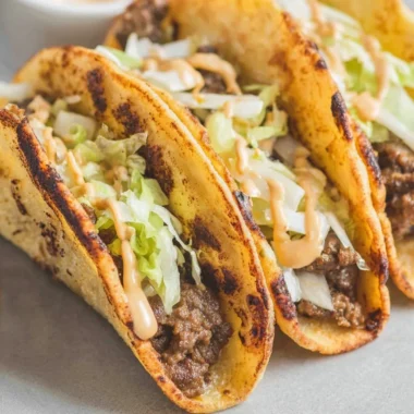 Delicious smash burger tacos served with fresh ingredients and vibrant toppings
