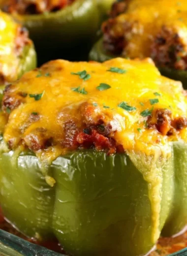 Colorful stuffed peppers with a variety of fillings on a plate