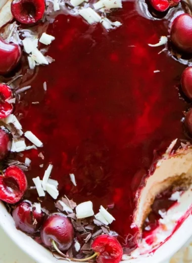 Delicious Cherry Tiramisu dessert served in a glass with cherries on top