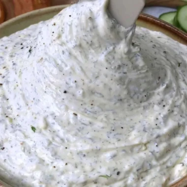 Cucumber Dip served in a bowl garnished with herbs, perfect for parties and gatherings