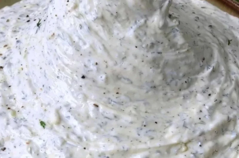 Cucumber Dip served in a bowl garnished with herbs, perfect for parties and gatherings