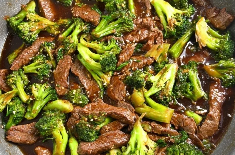 Gluten-free beef and broccoli served on a plate with vibrant vegetables