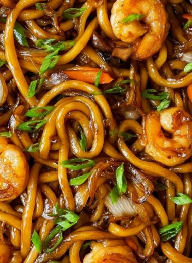 Plate of grilled udon noodles with vegetables and sauce