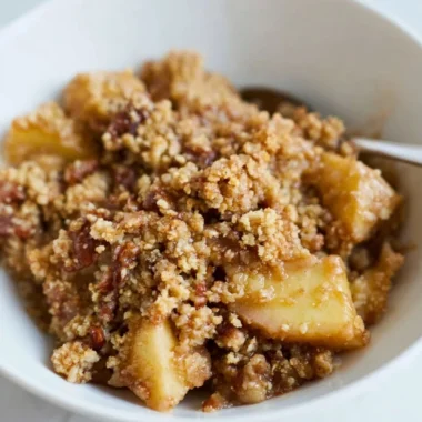 Healthy Breakfast Apple Crumble topped with oats and nuts