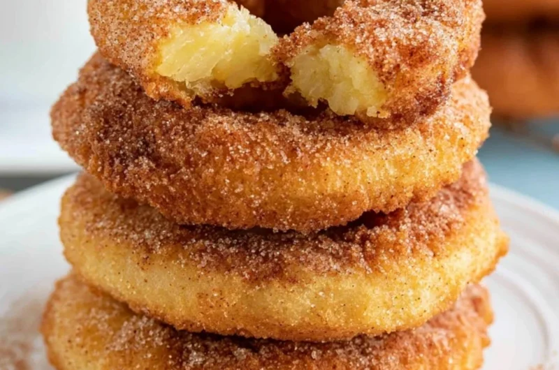Delicious pineapple fritter rings served on a plate
