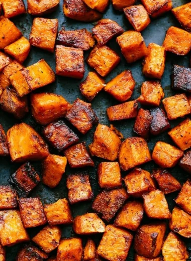 Colorful roasted vegetables on a plate, showcasing healthy and delicious eating.