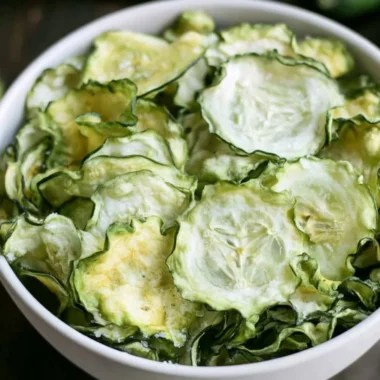 Salt and vinegar cucumber chips in a bowl, a healthy crunchy snack