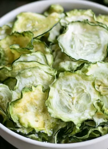 Salt and vinegar cucumber chips in a bowl, a healthy crunchy snack