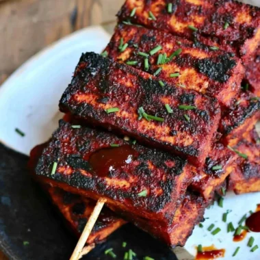 Delicious vegan sweet and spicy BBQ tofu served on a plate