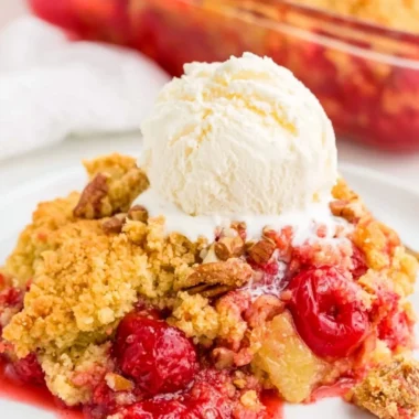 Cozy Cherry Dump Cake served with whipped cream and cherries on top