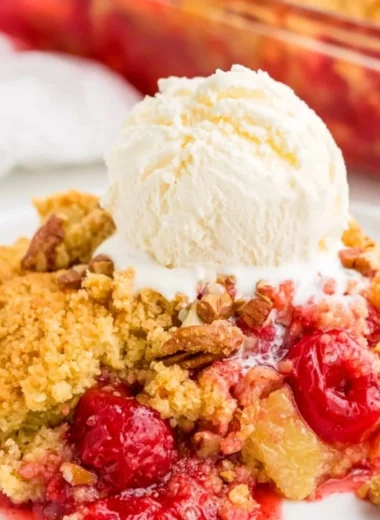 Cozy Cherry Dump Cake served with whipped cream and cherries on top
