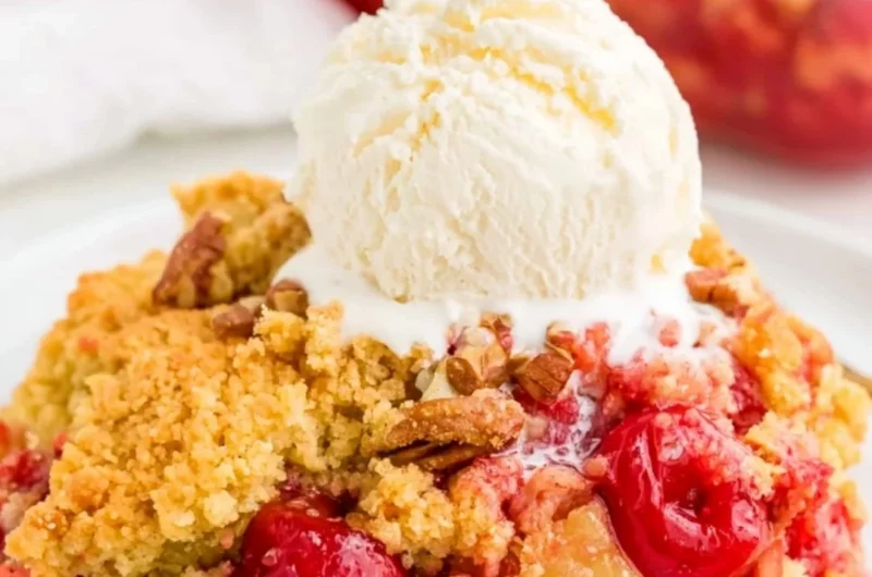 Cozy Cherry Dump Cake served with whipped cream and cherries on top
