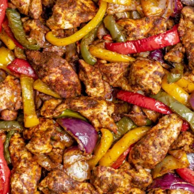 Delicious sheet pan chicken fajitas with vibrant peppers and onions ready to serve.