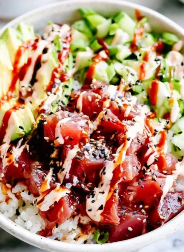 Cozy spicy tuna poke bowl with fresh tuna, avocados, and seasonings