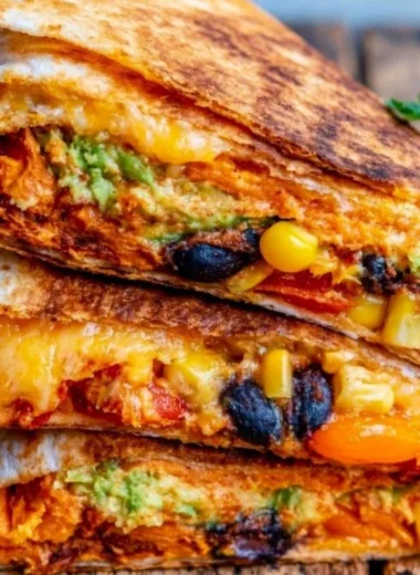Delicious vegetarian quesadillas served with fresh toppings and dipping sauces.