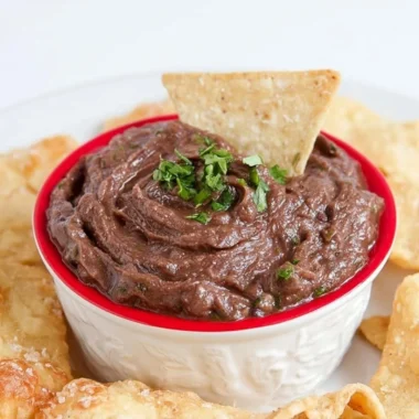 Quick and easy vegan black bean dip served with tortilla chips