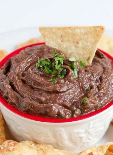 Quick and easy vegan black bean dip served with tortilla chips