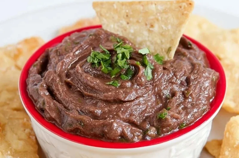 Quick and easy vegan black bean dip served with tortilla chips