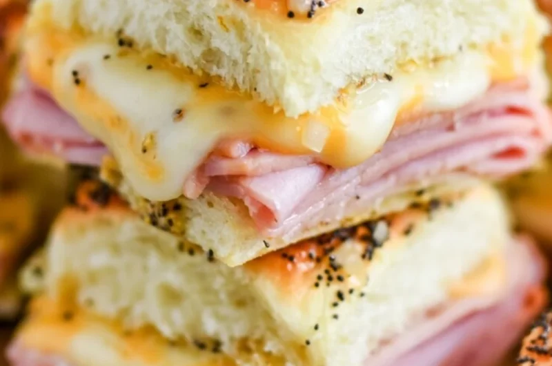 Delicious ham and cheese sliders on a platter ready for serving.