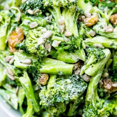 Bowl of simple broccoli slaw with carrots and dressing