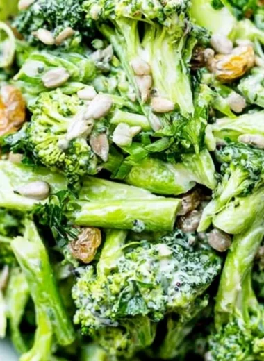 Bowl of simple broccoli slaw with carrots and dressing