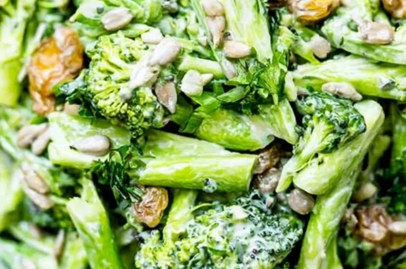 Bowl of simple broccoli slaw with carrots and dressing