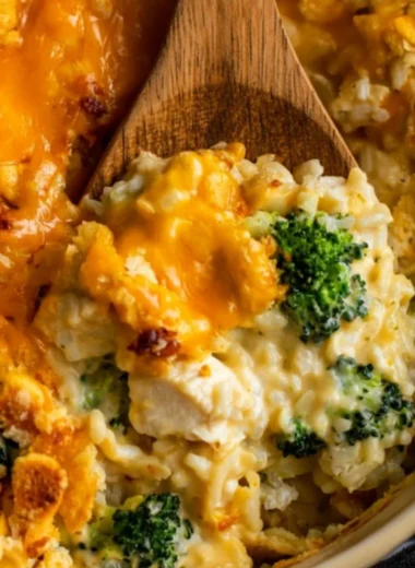 Delicious Broccoli Cheddar Chicken and Rice Casserole topped with cheese
