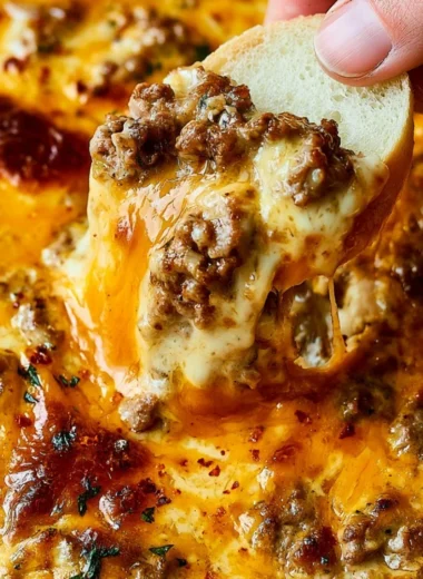 Cheesy ground beef dip served with tortilla chips for game day appetizers
