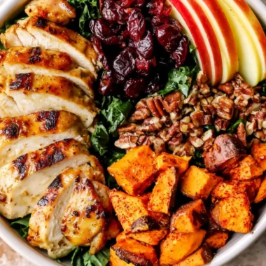 Harvest Chicken Bowl with Maple Dijon Dressing Recipe topped with fresh ingredients