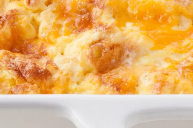 Oven scrambled egg and cheese bake casserole on a plate, ready to serve for breakfast.