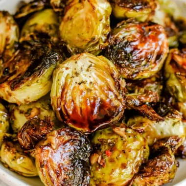 Roasted Brussels sprouts with honey balsamic sauce on a serving plate