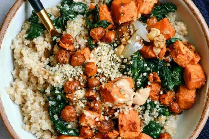 Vegan sweet potato grain bowls topped with almond dressing, fresh and colorful ingredients.